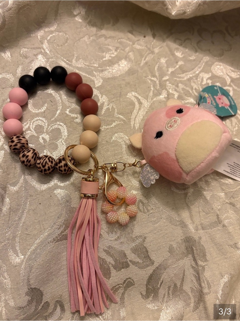 Handmade silicone bracelet key ring with attached authentic mini plush charm